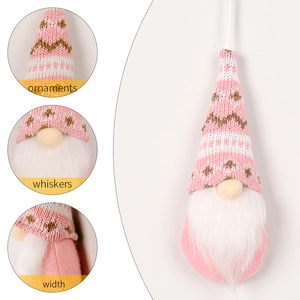 Pink knitted Christmas gnome ornament with heart pattern and white beard for tree decoration