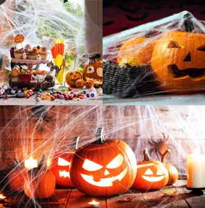 Close-up of Halloween decoration set with giant spider webs, pumpkin lights and ghosts