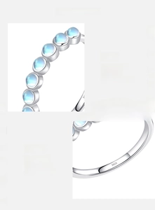 Detail of S925 sterling silver stamp and round moonstone inlay with blue sheen