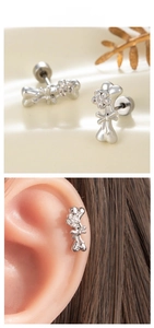 Detail of dog bone ear studs with bow and crystals shown on model and display