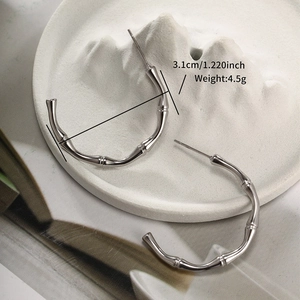 Detailed view of silver bamboo texture hoop earrings with 3.1cm diameter measurements