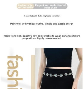 Bohemian silver chain belt with turquoise sun pattern medallions worn on a dress