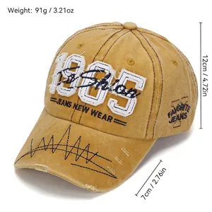 Vintage washed khaki baseball cap with 1985 3D embroidery and distressed brim details