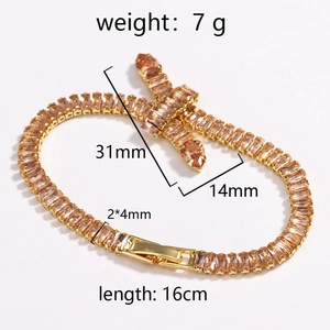Detail view of gold tennis bracelet featuring amber zircon stones and bow design with dimensions