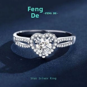 Close-up of S925 sterling silver heart-shaped moissanite ring with detailed side pavé setting
