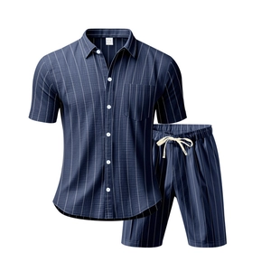 Detailed view of dark blue striped linen set including button-up shirt and drawstring shorts