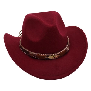 Detail of burgundy felt cowboy hat featuring a braided band and golden feather ornament