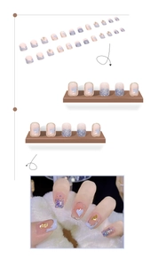 Detail of short square press-on nails with lavender and pink hearts and gold foil accents