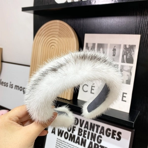 Detailed view of plush two-tone faux fur headband texture with a soft non-slip lining