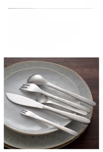 Detail showing matte 304 stainless steel cutlery set with engraved OUDING logo on handles