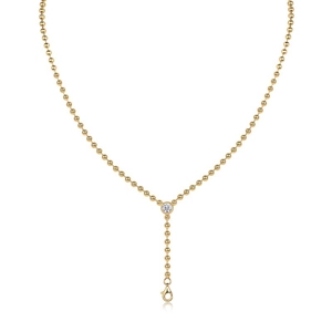 Detail view of a gold S925 silver Y-shape beaded necklace with a round moissanite pendant