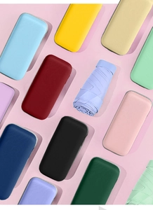 Matrix of colorful portable sun umbrellas in hard cases showing diverse vibrant color options