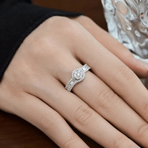 Elegant S925 sterling silver ring with sparkling round and baguette-cut zircons on hand