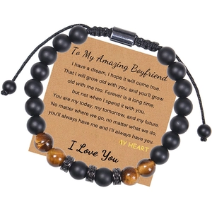 Detail of tiger eye and matte stone beaded bracelet with adjustable woven cord for men
