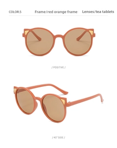 Front and 45-degree views of red-orange cat-ear sunglasses with tea lenses and gold accents