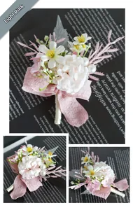 Detail of light pink artificial boutonniere with pearl accents and ribbon for weddings