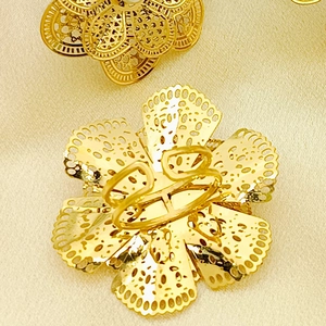 Adjustable golden stainless steel ring featuring intricate hollow floral mesh pattern