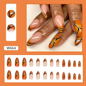 Almond shaped fake nails with orange and black butterfly wing design, 24 piece set