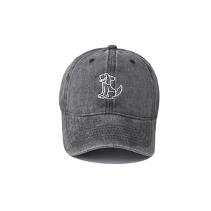 Close-up of the vintage washed cotton baseball cap featuring minimalist dog embroidery