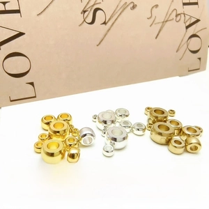 Close-up of 14k gold plated brass spacer beads in various sizes for DIY jewelry making
