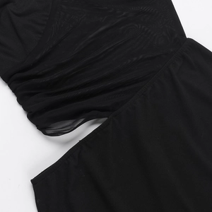 Detail of black sexy bodycon dress showing mesh splicing and pleated hollow design