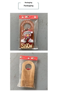 Detail of Christmas snowman wooden door hanger in retail transparent packaging with red card