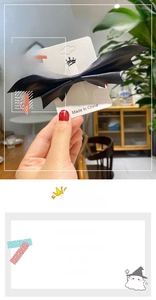 Detail showing high-quality black skin-feel leather bat wing hair clip for Halloween