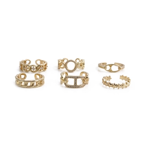 6-piece gold-tone ring set featuring star and chain designs with sparkling rhinestones