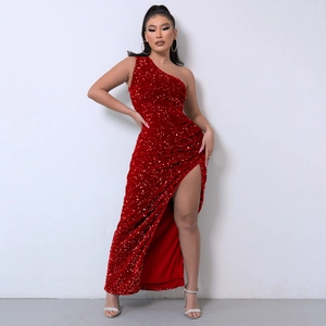 Detail of red sequined one-shoulder evening gown with high slit and elegant tailoring