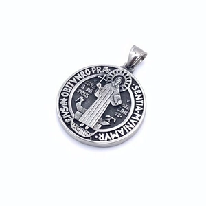 Vintage stainless steel Saint Benedict round relief pendant with embossed religious motifs