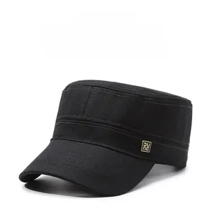 Detailed view of the black cotton twill flat top cap featuring a metal logo plate