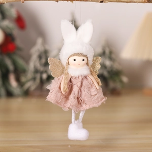 Detail of plush Christmas angel ornament with bunny ears and lace dress on a festive tree