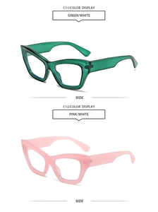 Detail view of retro cat eye sunglasses in transparent green and pink resin frames