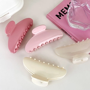 Set of four French-style semi-circle acrylic claw clips in various pink and cream shades