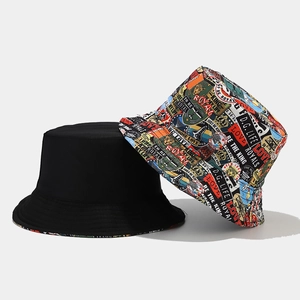 Detailed view of reversible graffiti bucket hat showing colorful print and black cotton fabric