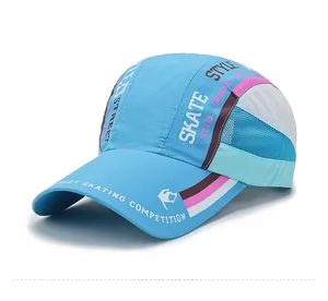 Detail of breathable mesh stitching and skate-style graphics on light blue baseball cap