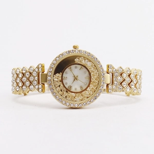 Luxurious gold-tone women's watch with floating diamonds and rhinestone-encrusted strap