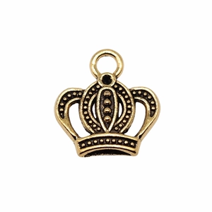 Close-up of golden crown pendant with textured surface and ring loop for jewelry