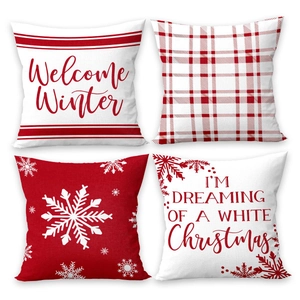 Set of 4 Christmas pillow covers with red and white snowflake patterns and holiday text