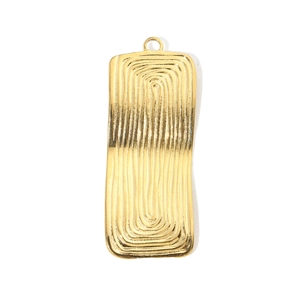Macro detail of golden geometric sector pendant with hammered texture for DIY jewelry