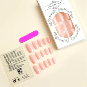Macro shot of 24pcs pink press-on nails with mini nail file and adhesive sticker
