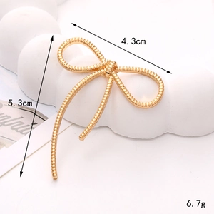 Golden zinc alloy bow-shaped accessory for DIY jewelry with 4.3cm x 5.3cm dimensions
