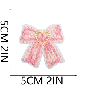 Detailed view of pink heart embroidery patch with size measurements 5cm x 5cm