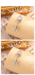 Detailed view of punk style heart flame stud earrings with screw back cone in pink and white