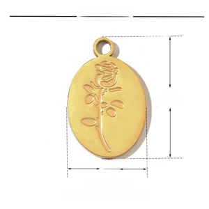 Detailed view of golden stainless steel oval pendant featuring embossed rose floral pattern