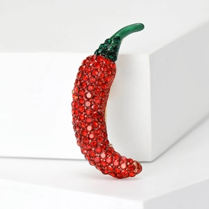 Sparkling red chili pepper brooch with green rhinestones and elegant gold-tone metal base