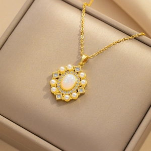Elegant gold necklace with oval opal pendant surrounded by pearls and zircons