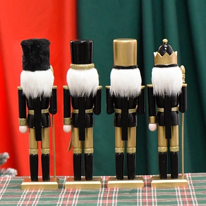 Set of 4 black and gold wooden nutcracker king soldiers shown from the back view for Christmas