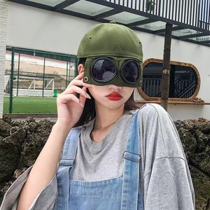 Army green aviator baseball cap featuring integrated black goggles for a trendy look
