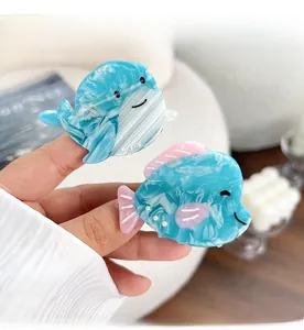 Detailed macro view of whale and fish hair claws made of high quality acetate marble material